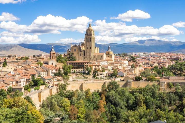 a castle like building with Segovia in the background