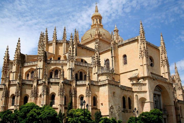 a large church with Segovia in the background